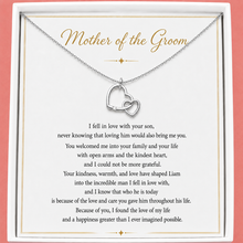 Load image into Gallery viewer, Necklace with interlocking heart pendants on a card for 'Mother of the Groom' with a heartfelt message.