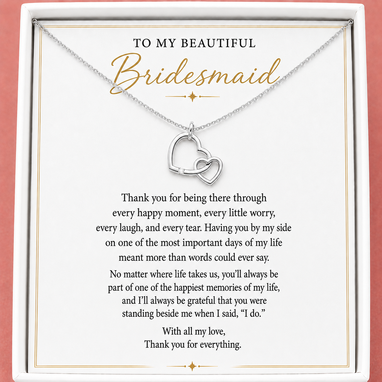 A silver double heart pendant necklace displayed inside a white gift box with a sentimental message card addressed 'TO MY BEAUTIFUL Bridesmaid'.