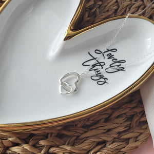 Two connected hearts necklace symbolising the unbreakable bond between the groom and the bride to be.