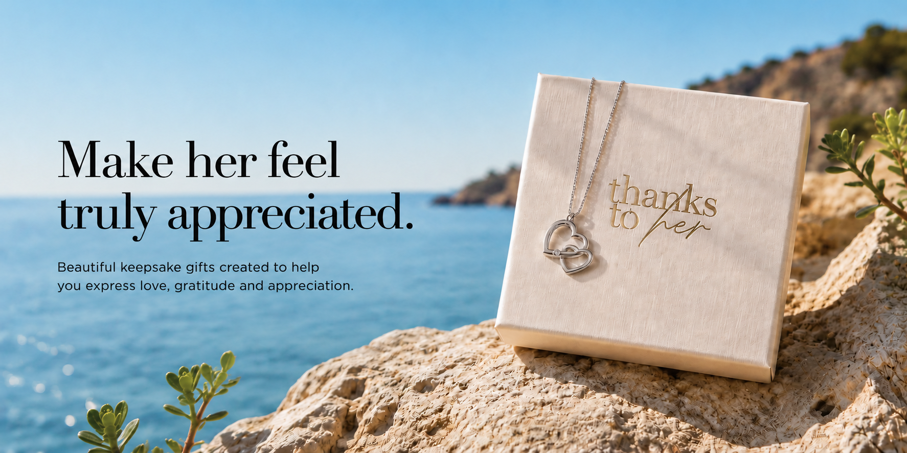 Two connected hearts necklace displayed on a luxury Thanks To Her gift box, a meaningful jewellery gift to express love, gratitude and appreciation.