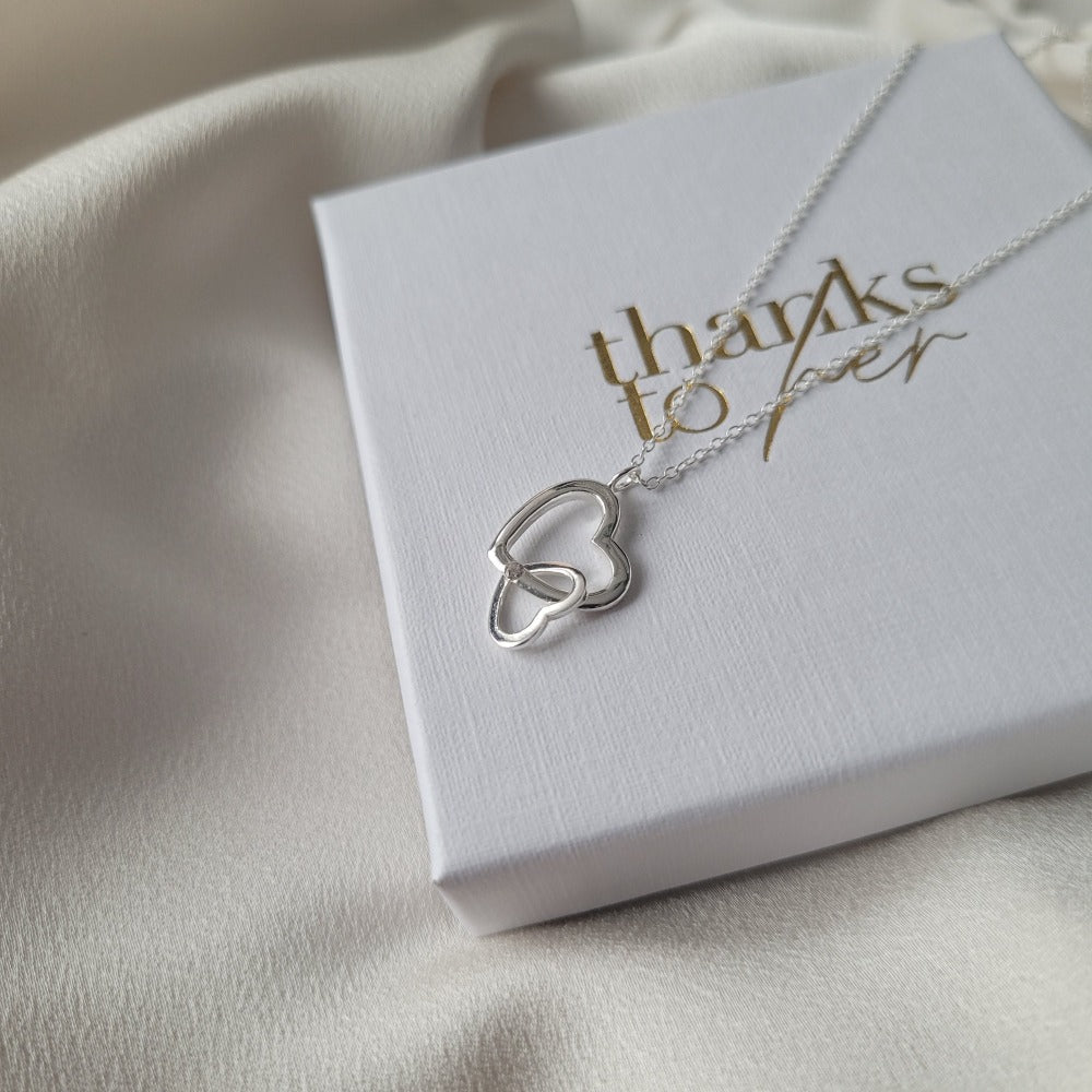 Sterling silver necklace for mother's day. Two connected hearts necklace for mum.